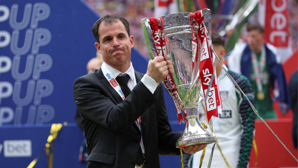 Regis Le Bris lifting Championship play-off trophy with Sunderland.