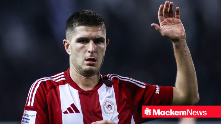 Lorenzo Pirola holds his hands up