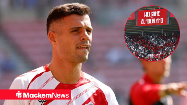 Granit Xhaka glances concernedly towards Sunderland fans.