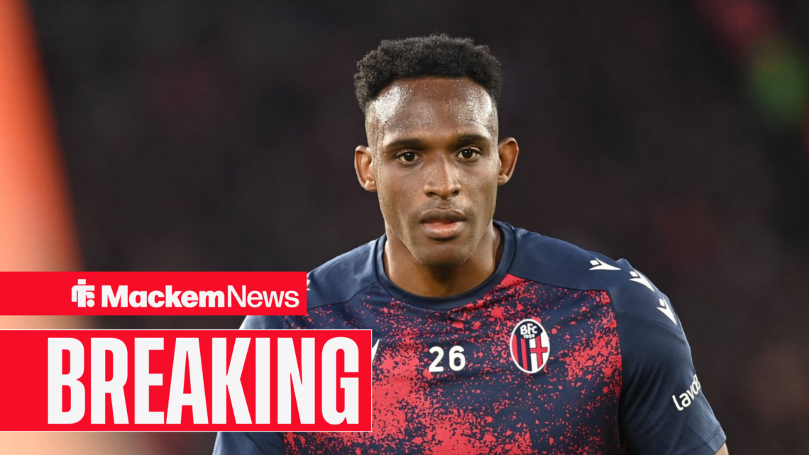 Jhon Lucumi in Bologna training kit with a breaking news banner