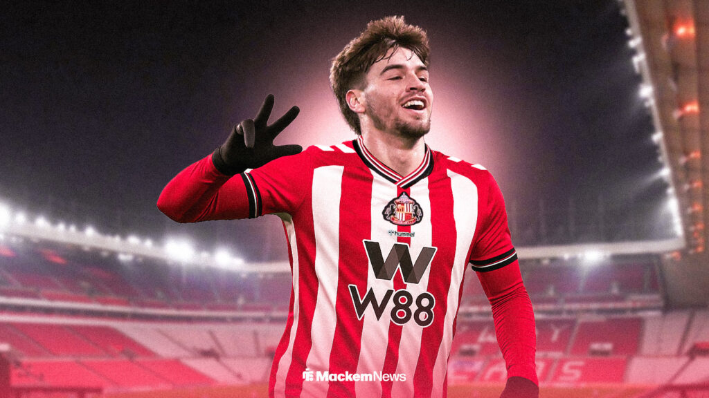 Sunderland striker Marc Guiu celebrates in the club's home kit.