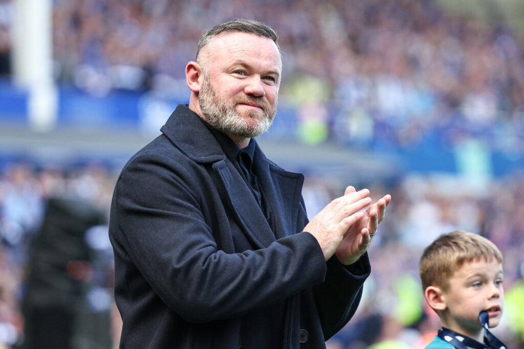 Wayne Rooney claps his hands while smiling