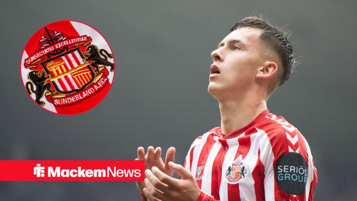Sunderland badge on the left with Chris Rigg on the right clapping and looking to the left