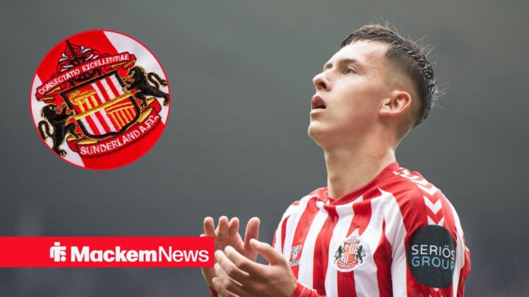 Sunderland badge on the left with Chris Rigg on the right clapping and looking to the left