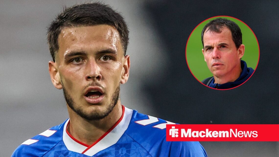 Enzo Le Fee looking concerned with Regis Le Bris in frame