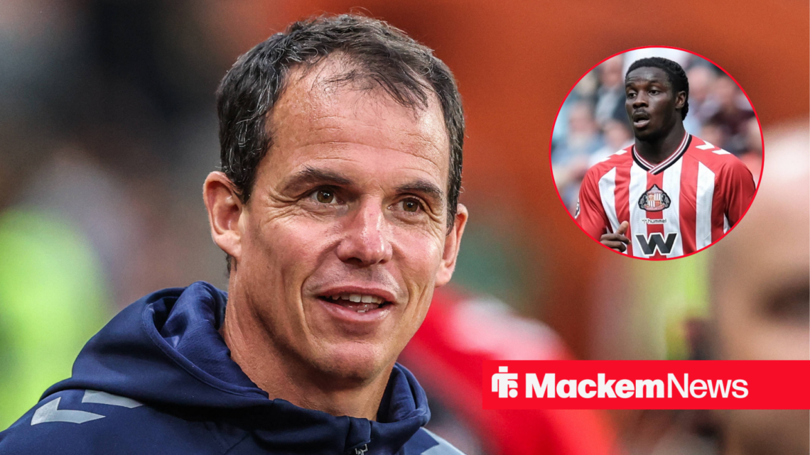 Eliezer Mayenda looks at Sunderland manager Regis Le Bris.