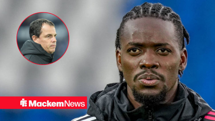 Bertrand Traore looking focused with Regis Le Bris in frame
