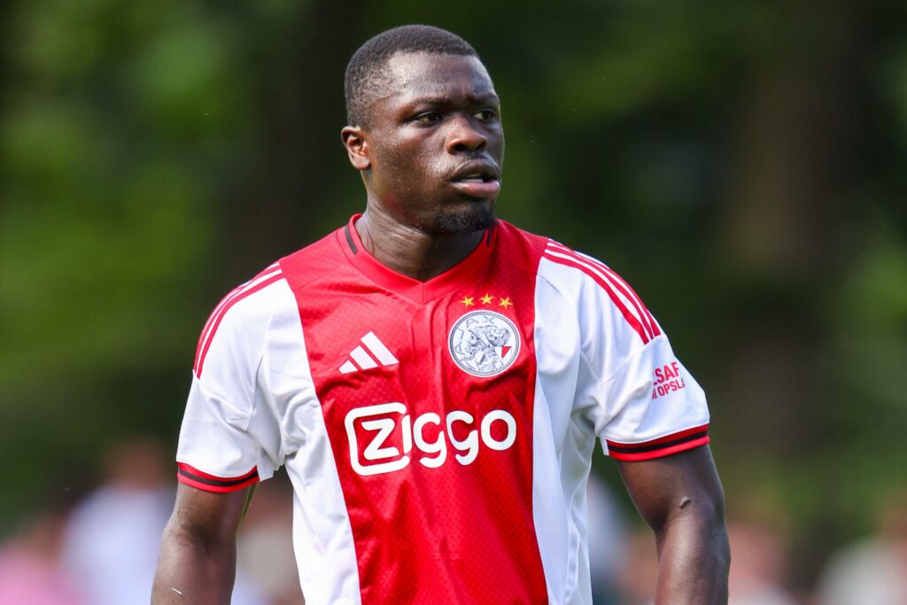 Brian Brobbey playing for Ajax in their home kit
