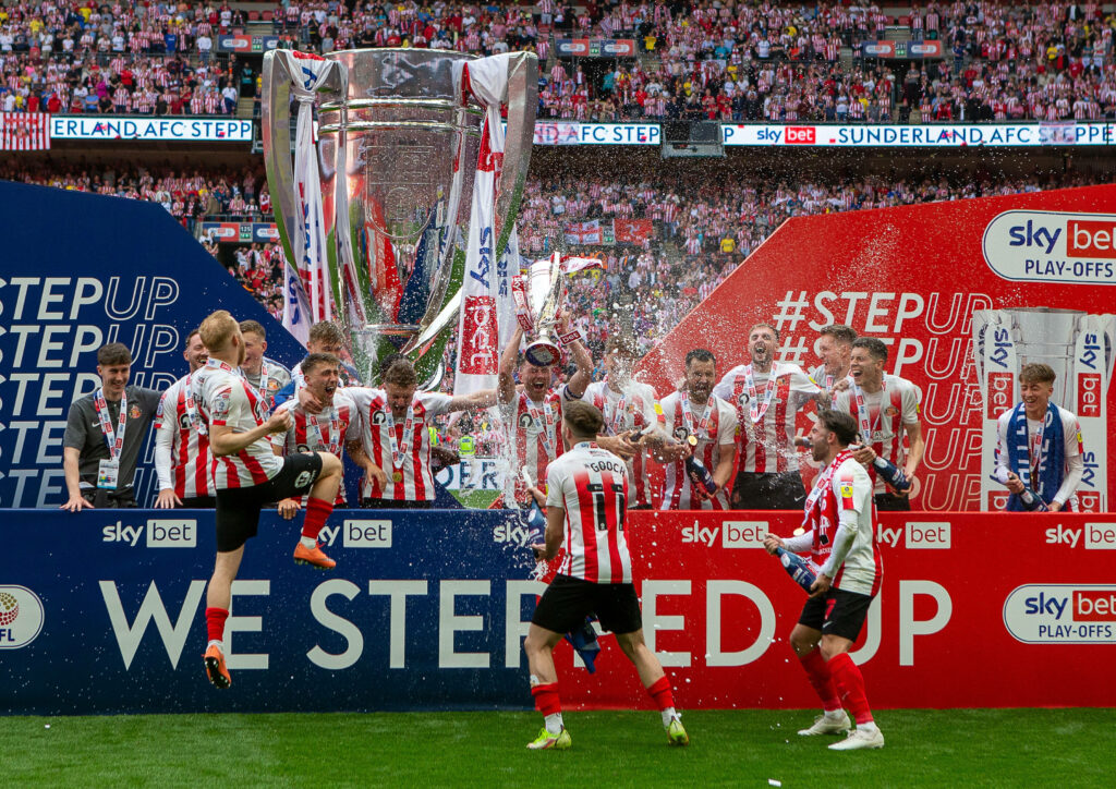 Sunderland lift the League One play-off trophy.