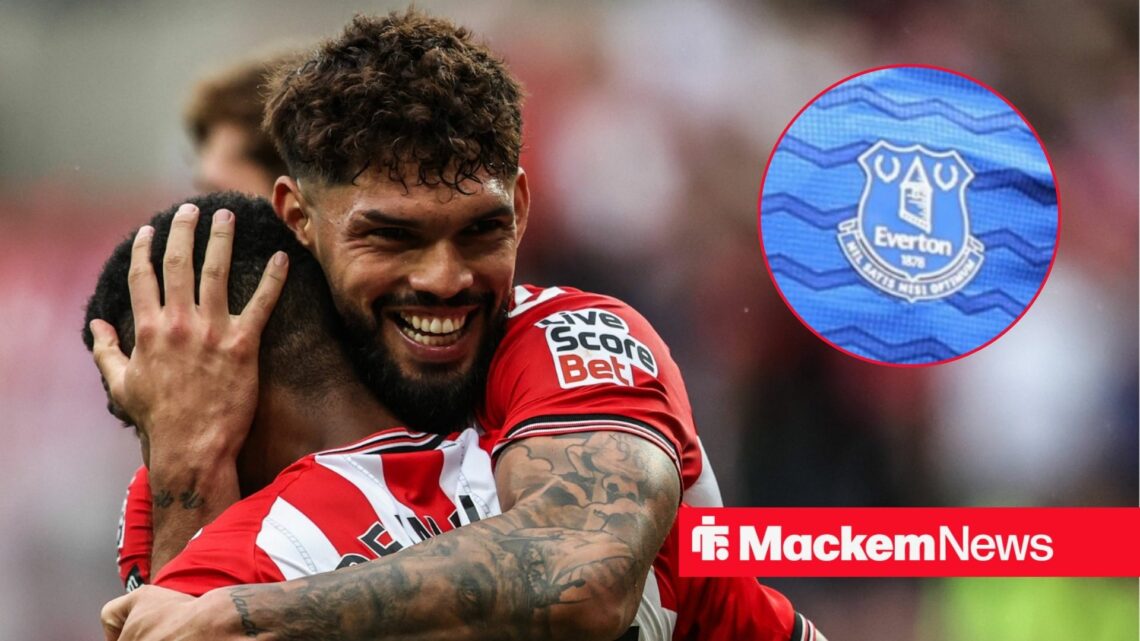 Omar Alderete smiling with Everton badge in frame