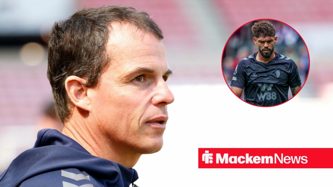 Regis Le Bris looking on with Omar badge in frame