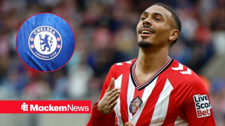 Wilson Isidor celebrating with Chelsea badge in frame