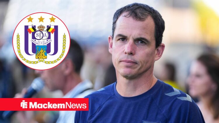 Sunderland manager Regis Le Bris stares concernedly towards the RSC Anderlecht badge, which features in a circular inset.