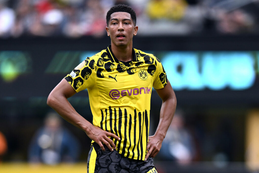 Ex-Sunderland star Jobe Bellingham stands with his hands on his hips during a game for Borussia Dortmund.