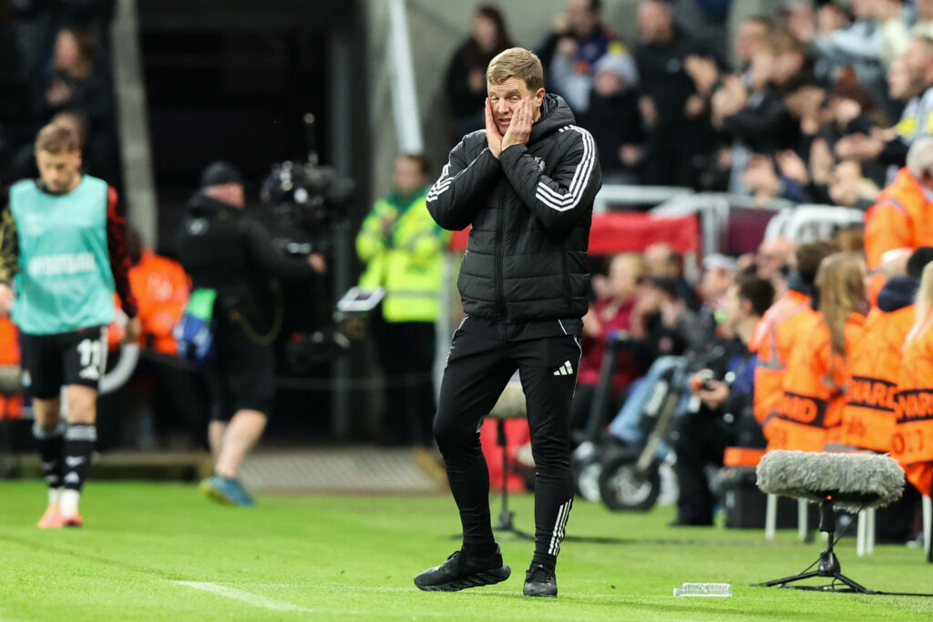 Newcastle manager Eddie Howe with his head in his hands.