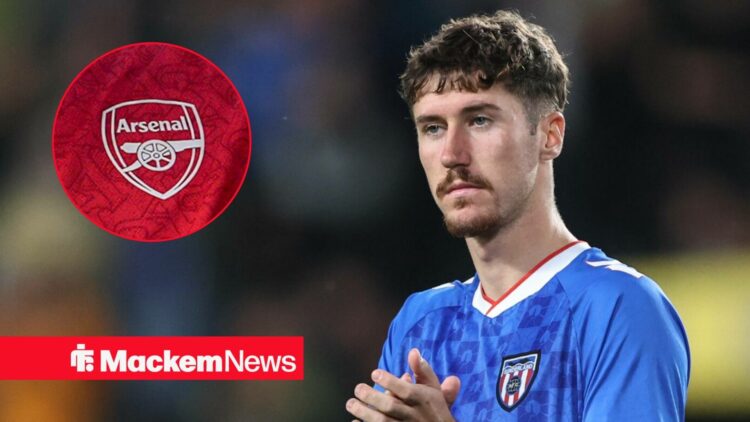 Trai Hume playing for Sunderland with Arsenal badge in frame