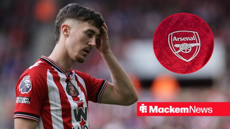 Trai Hume for Sunderland with Arsenal badge in frame