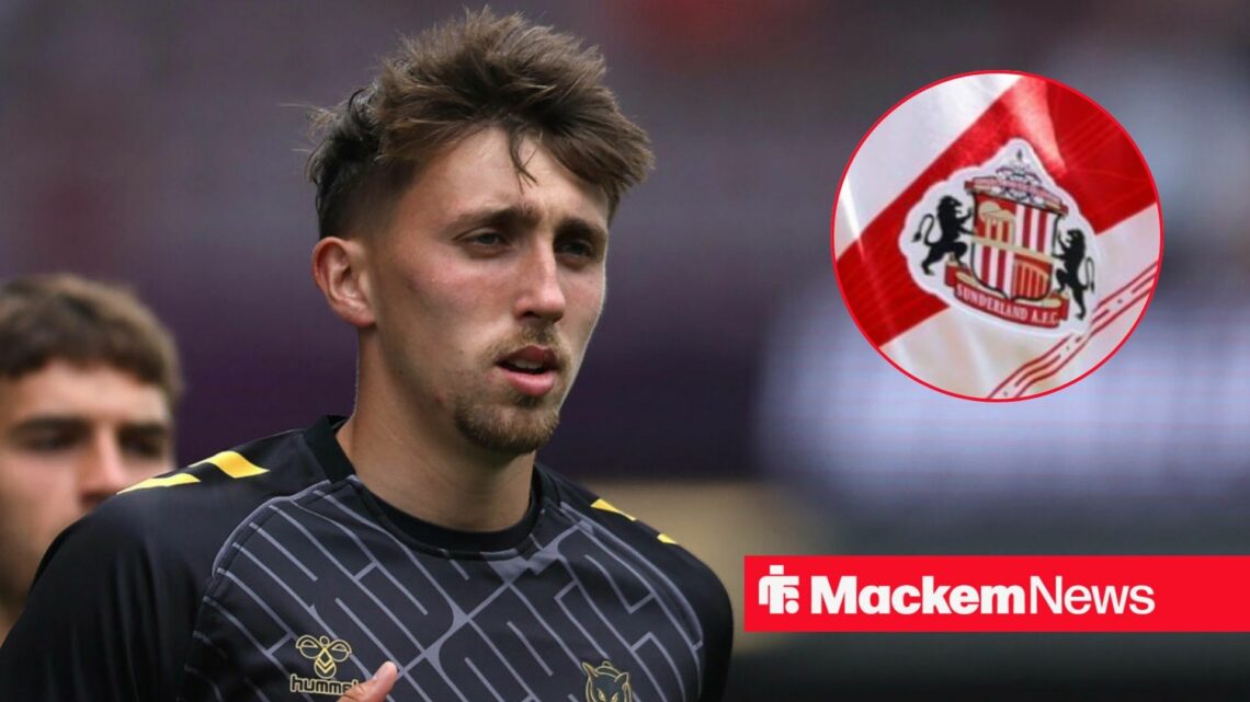 Dan Neil with Sunderland badge in frame