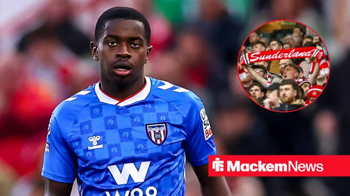 Noah Sadiki getting stared at by joyous Sunderland fans.