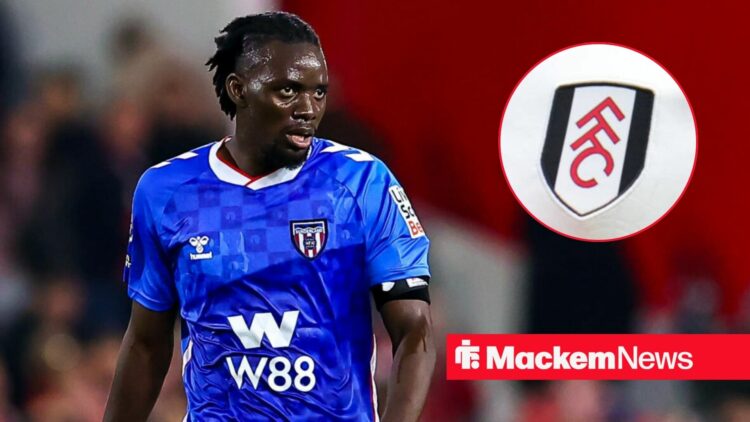 Bertrand Traore with Fulham badge in frame