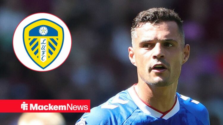 Granit Xhaka in action for Sunderland looking at Leeds United badge in circular inset