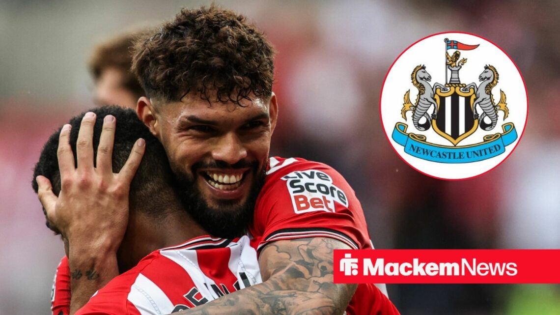 Omar Alderete smiling in the direction of the Newcastle badge.