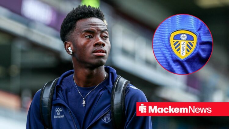 Simon Adingra with Leeds badge in frame