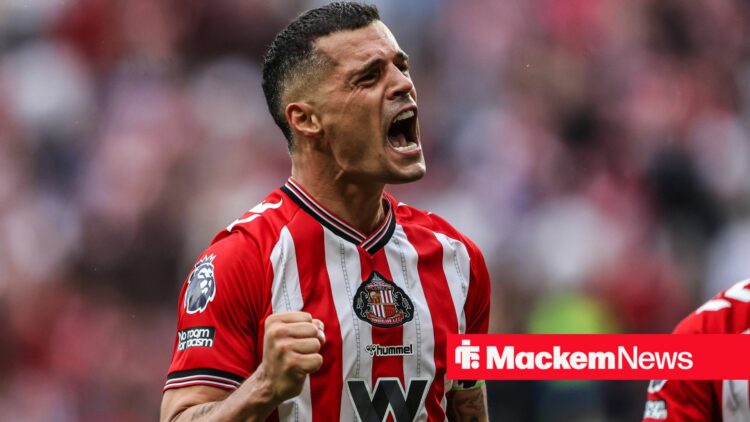 Granit Xhaka celebrates in front of the Sunderland fans.